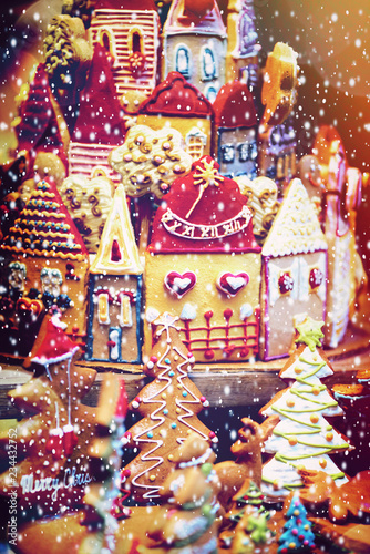 Little Christmas gingerbread cookies and a candy-covered gingerbread town houses.