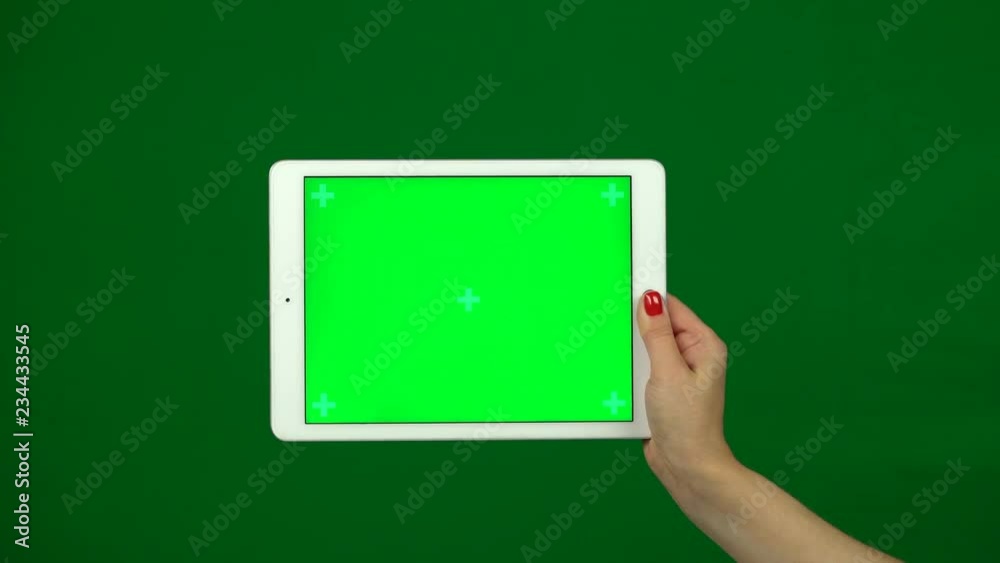 Laptop computer in the hands with green screen