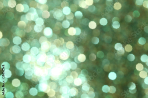 Christmas abstract green bokeh background with light color in blur.