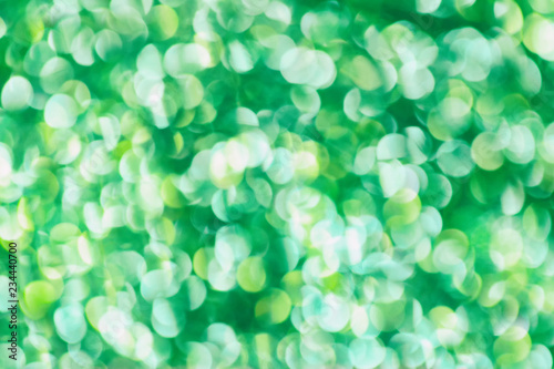 Christmas abstract green bokeh background with light color in blur.