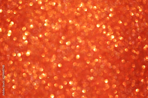 Christmas abstract Orange bokeh background with light color in blur.