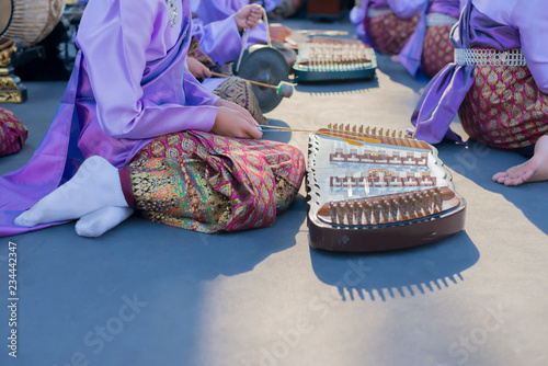 People who are playing traditional Asian music.