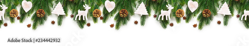 Christmas tree branches on white background as a border