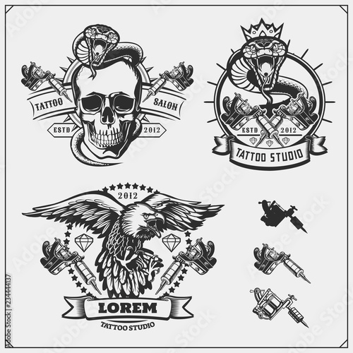 Set of tattoo salon labels, badges and design elements. Tattoo studio emblems with professional equipment, skull, eagle and cobra.