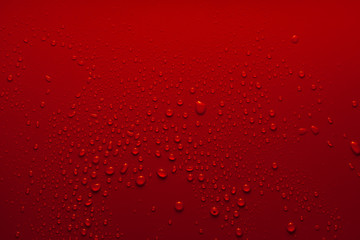 Water drops on a red background
