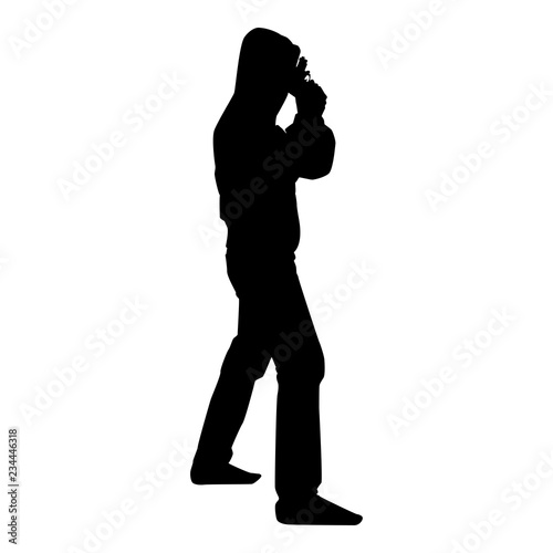 Man in the hood with gun Concept danger short arm near head icon black color illustration