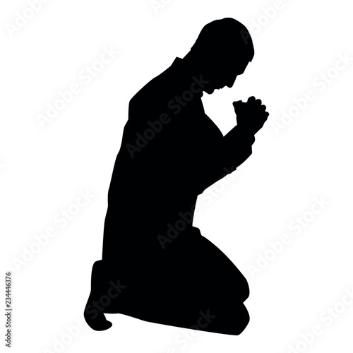 Obraz na plátně Man pray on his knees silhouette icon black color illustration