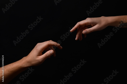 Male and female hands reach...
