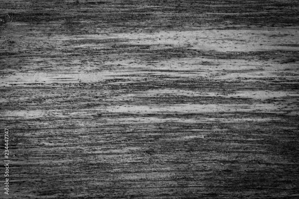dark vignette black and white background. peeling paint on an old wooden floor