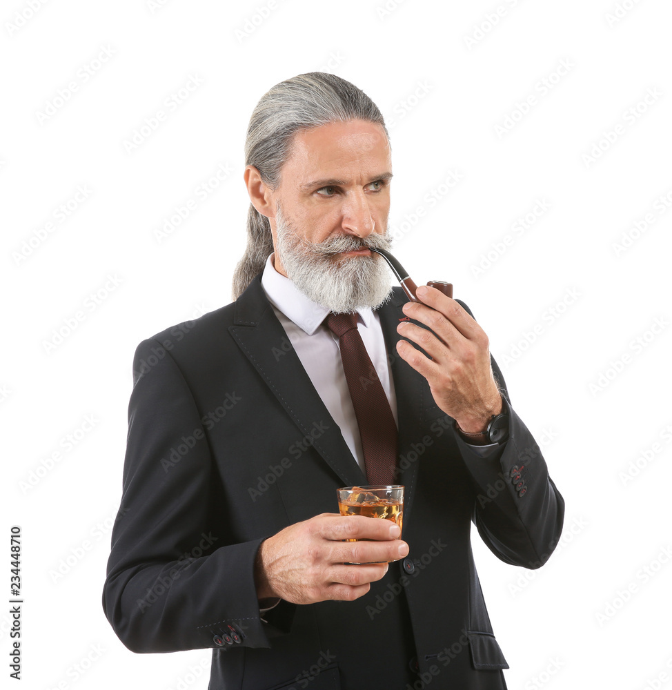 Elderly businessman with glass of whiskey and pipe on white background Elderly businessman with glass of whiskey and pipe on white background