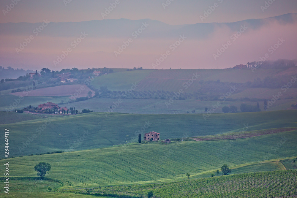 Obraz premium Tuscany landscape in the fog. Morning fog over the rolling hills of Montepulciano, Tuscany, Italy