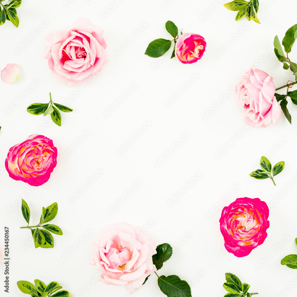 Floral composition of pastel pink roses flowers and green leaves on white background. Flat lay, top view. Spring time frame background