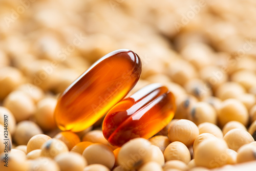 Lecithin gel pills capsule with soy background photo