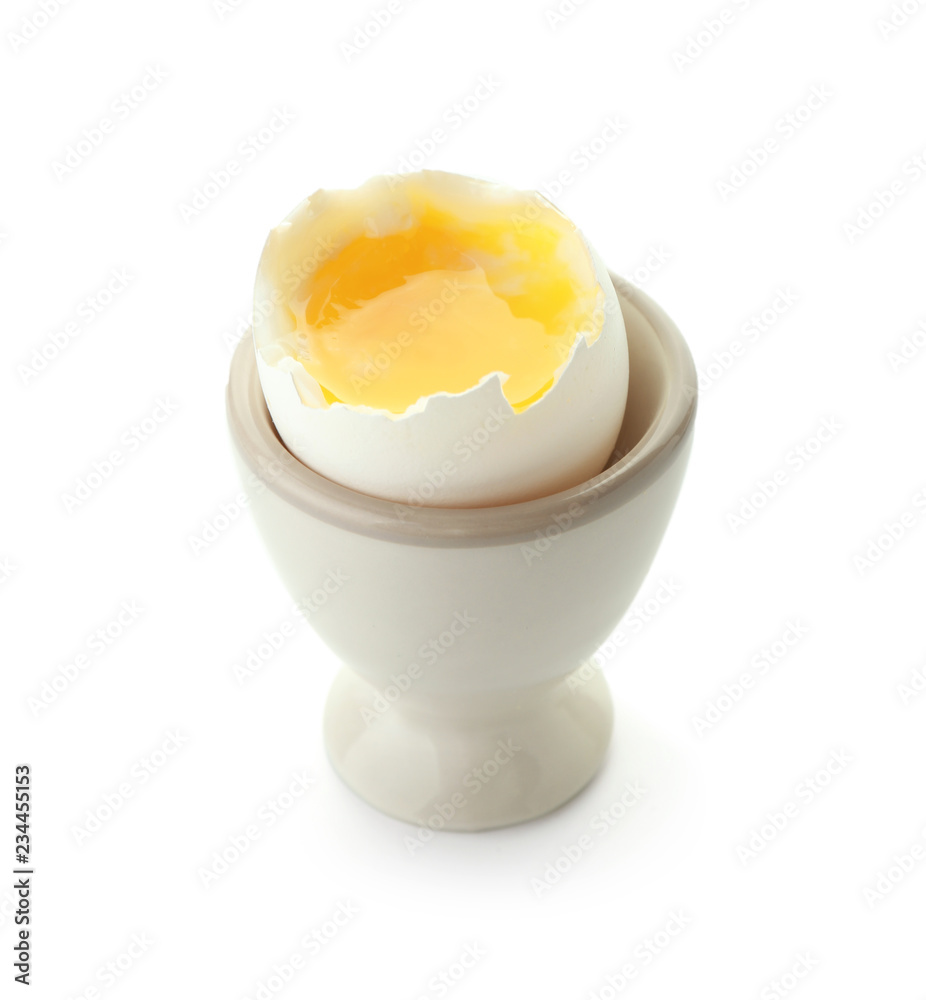 Boiled chicken egg in holder on white background Boiled chicken egg in holder on white background