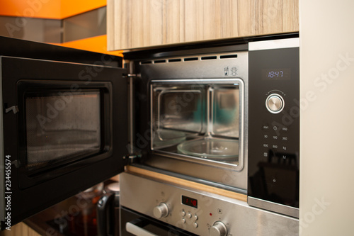 Photo of open microwave in kitchen