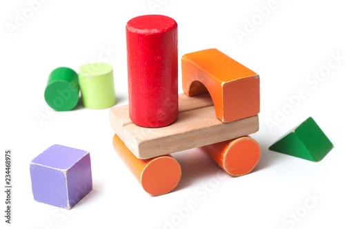 closeup of vehicle on colorful wooden blocks on white background