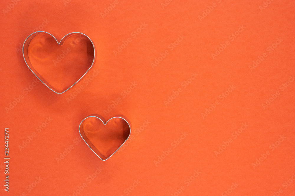 Obraz premium Cookie cutter love shape on red background.