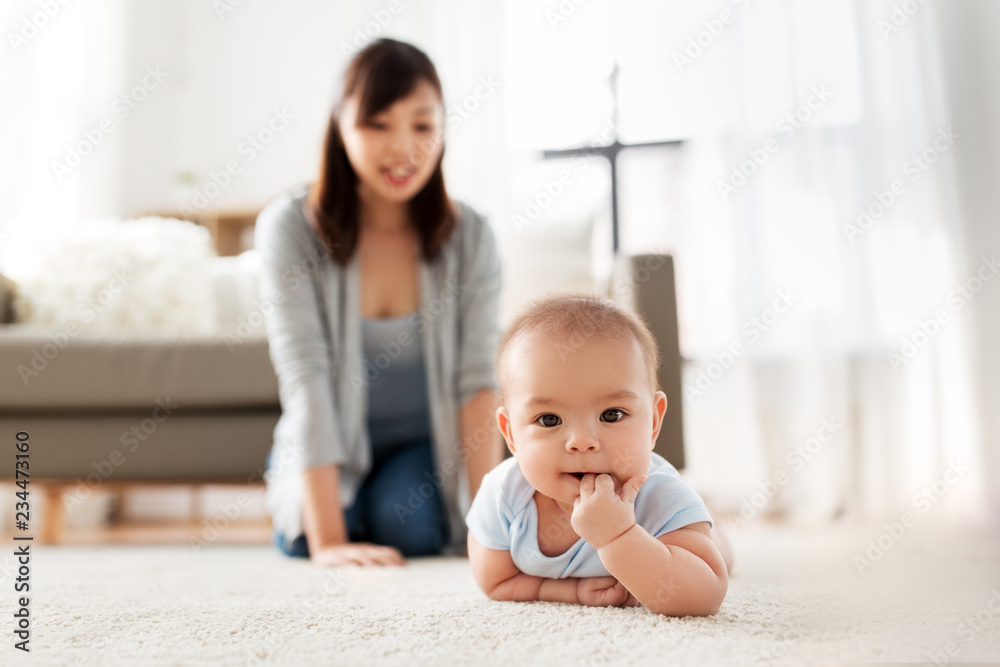 babyhood, childhood and people concept - sweet little asian baby boy and mother at home babyhood, childhood and people concept - sweet little asian baby boy and mother at home