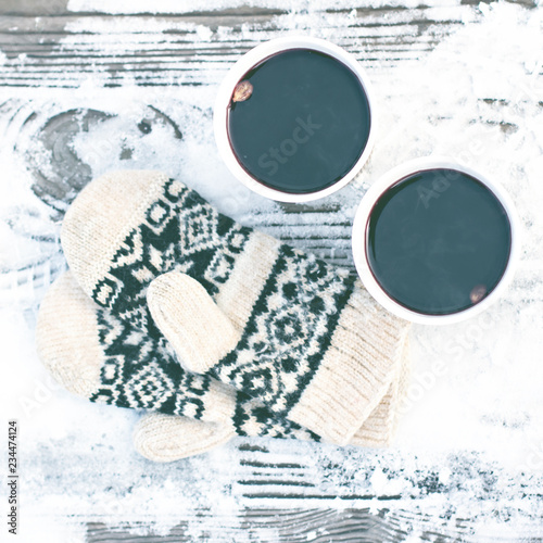 Fototapeta Naklejka Na Ścianę i Meble -  paper craft glass,  cup  with a hot drink, coffee, cocoa, mulled wine and white and black mittens
