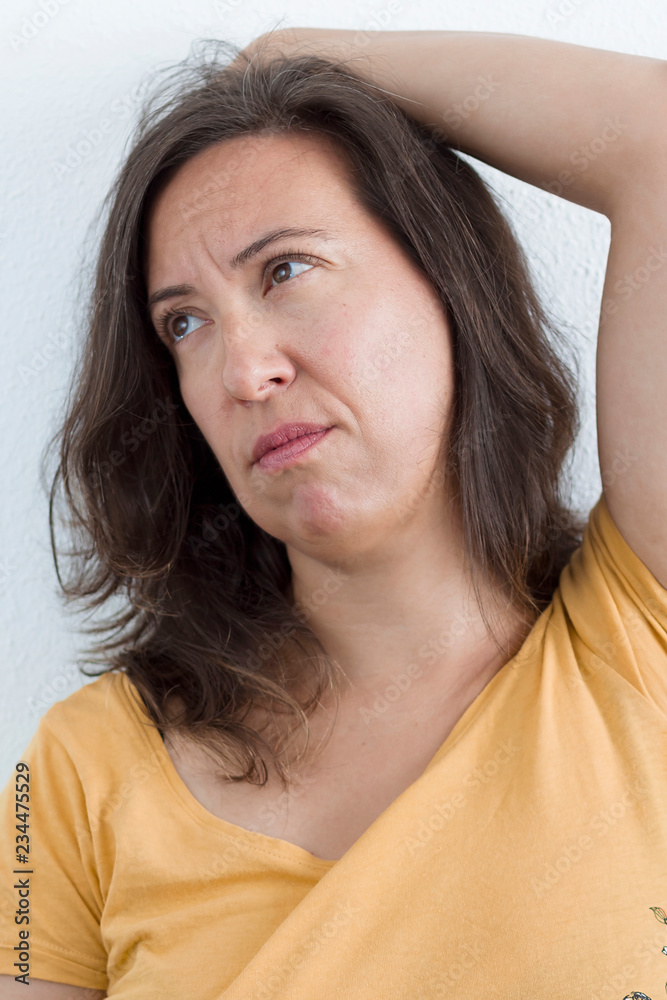A woman with a worried gesture A woman with a worried gesture
