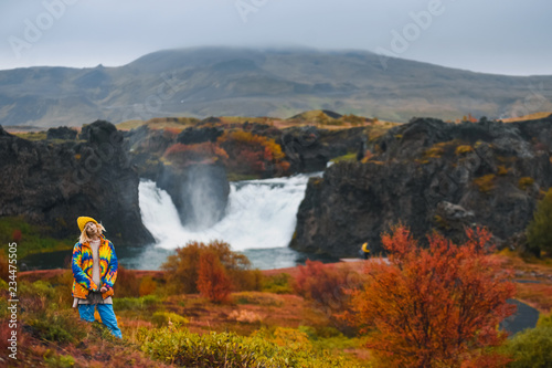 Majestic waterfall Hjalparfoss in Iceland in autumn in cloudy weather photo
