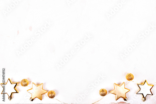 Christmas mood concept. Layout composition  traditional festive attributes  garland lights  star shaped tree decorations. Winter holidays season. Background  copy space  close up  top view  flat lay.