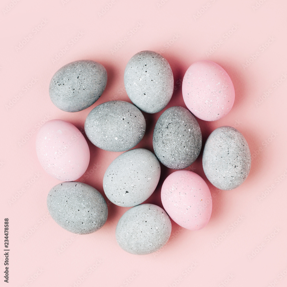Group pale pink and gray Easter eggs on pastel background. Flat lay Group pale pink and gray Easter eggs on pastel background. Flat lay