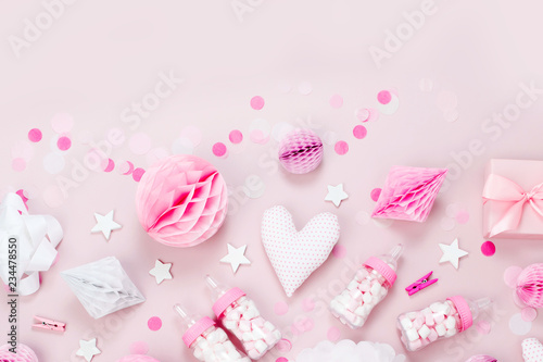Pink and white Paper Decorations, pom-pom, candy, hearts, gifts, confetti for Baby party. Birthday concept. Flat lay, top view