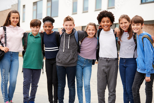 Portrait Of High School Student Group Standing Outside School Buildings