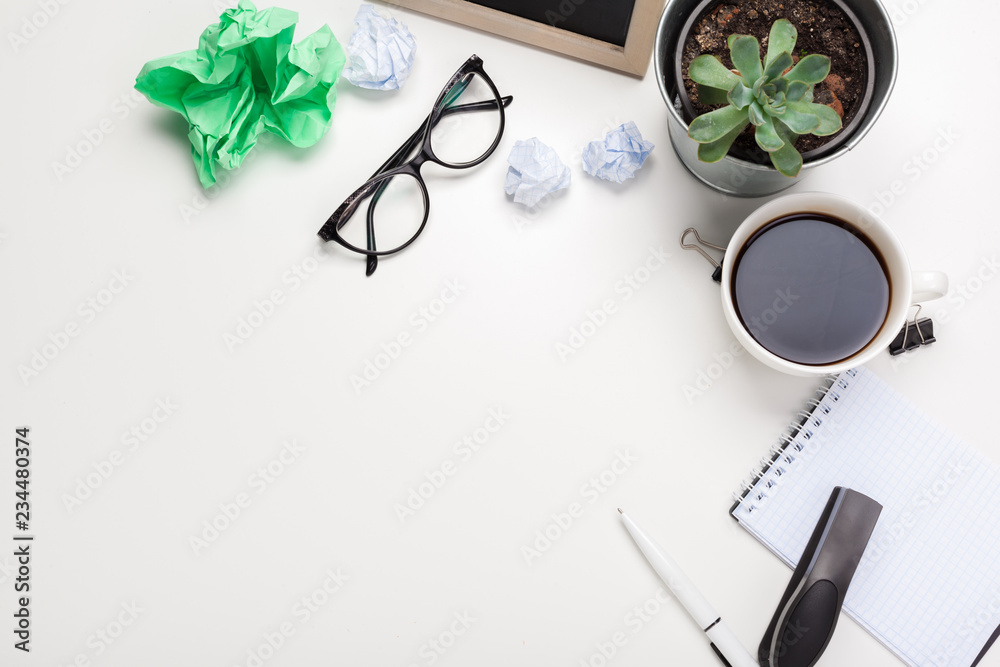 business creativity concept. Coffee, sheets of paper and crumpled wads on table business creativity concept. Coffee, sheets of paper and crumpled wads on table