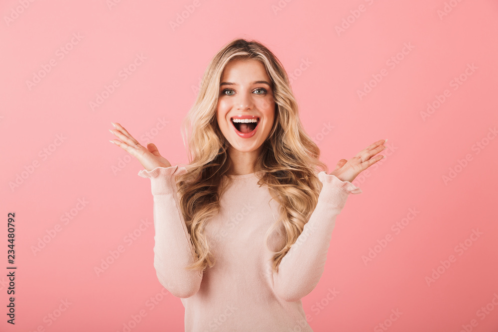 Portrait of a cheerful young woman wearing sweater Portrait of a cheerful young woman wearing sweater