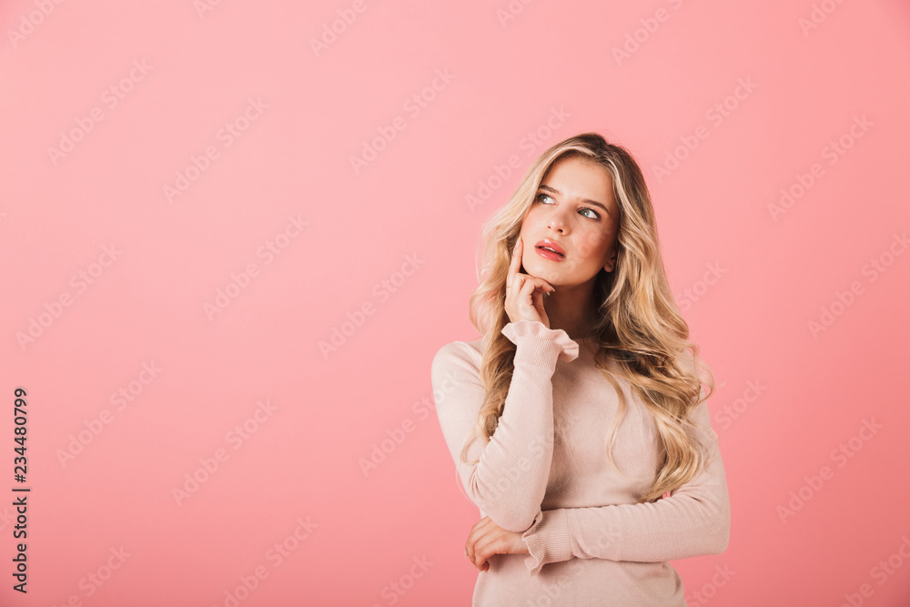 Portrait of a cheerful young woman wearing sweater Portrait of a cheerful young woman wearing sweater
