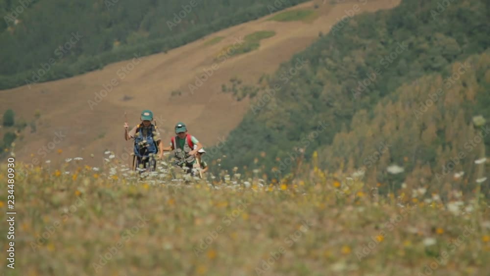 Three children go to the mountains on vacation. Three children go to the mountains on vacation.