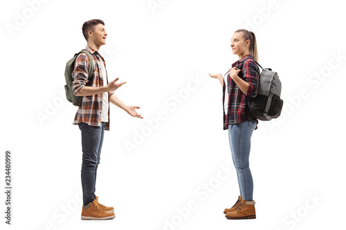 Teenage students talking with each other