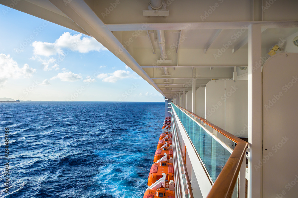 Fototapeta premium Cruise ship side with lifeboats and balcony.