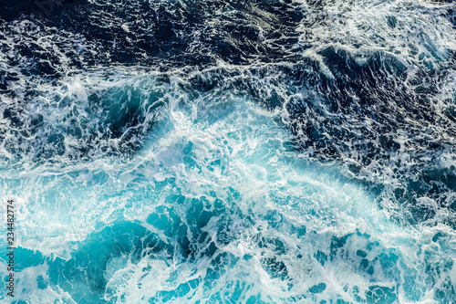 Sea waves and foam from a cruise ship © Sergey Kelin