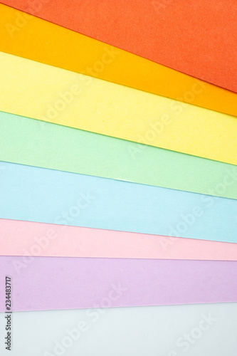 Multi color papers on white background.