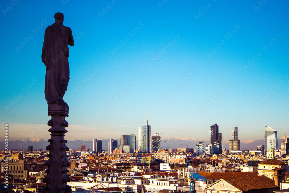 Panoramic view of Milan on business district of Porto Nuovo with modern skyscrapers from roof of gothic cathedral Duomo, Milan, Italy