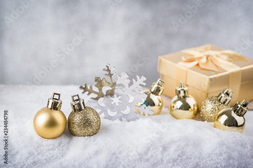 Merry Christmas.Christmas decoration with Gold ball on snow.