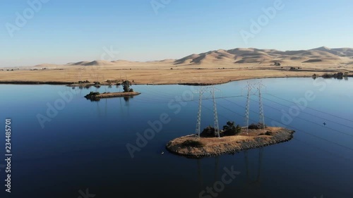 Electricity cables over artificial Lake in California photo