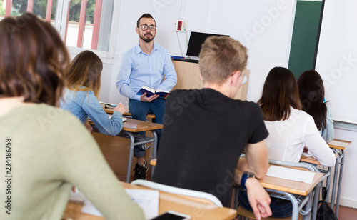 Teacher is giving lecture for students