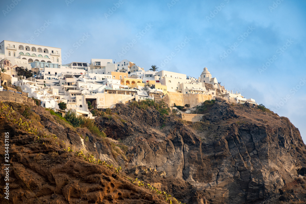 Panoramic view Traditional famous white houses and churches in Thira town on Santorini island, Greece