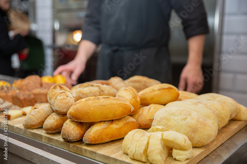 Fresh pastries for sale in a bakery. Sales of different types of bread in the farmers' markets. Sweet pastry at the market.