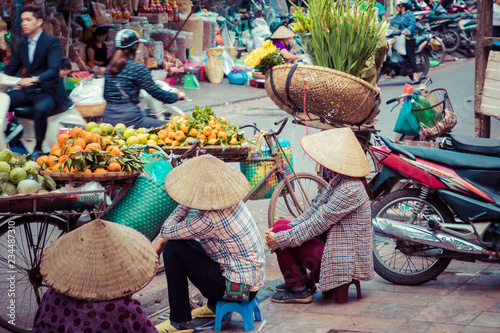 Fresh vegetables and fruits in traditional street market in Hanoi, Vietnam.
