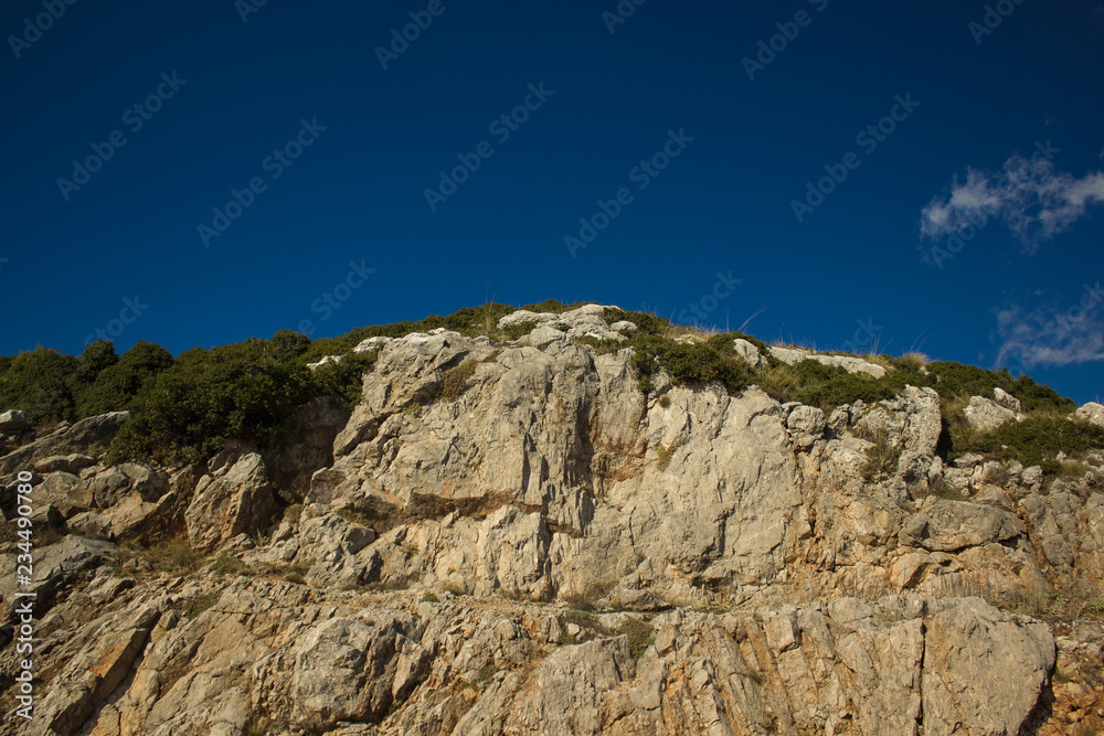 picturesque mountain rock nature landscape good place for hiking on vivid blue sky background picturesque mountain rock nature landscape good place for hiking on vivid blue sky background