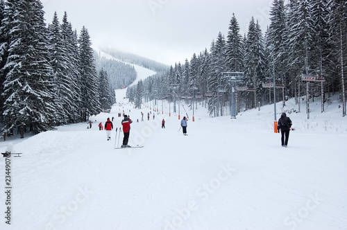 View of the ski slope and cable car on a winter day in the ski resort Jasna.
