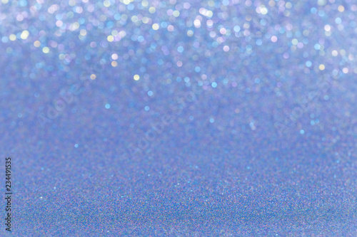 Blue glitter full frame shiny abstract background, shallow depth of field.