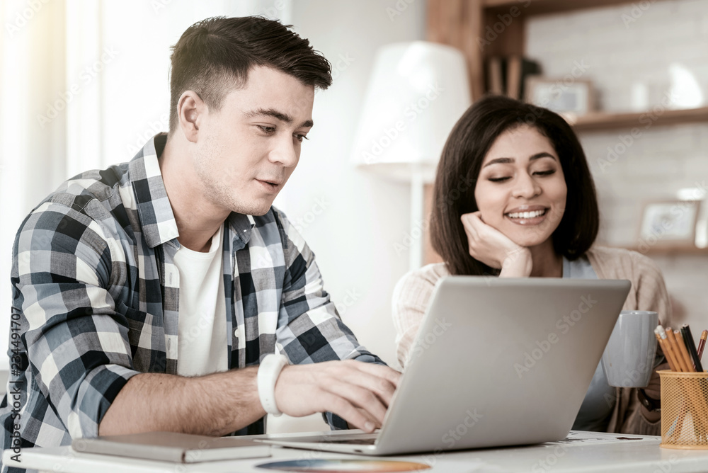 My support. Attentive brunette staring at computer while checking his email My support. Attentive brunette staring at computer while checking his email