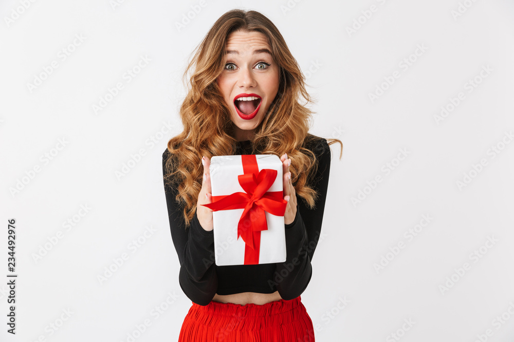 Fototapeta premium Portrait of an excited pretty young woman