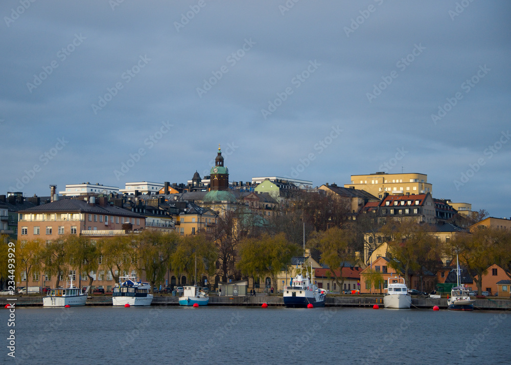 Houses, Pier and Boats on Kungsholmen island in Stockholm